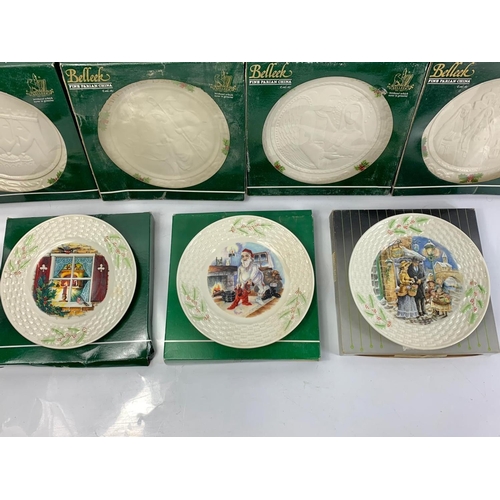 503 - 7 Belleek pottery Christmas plates in boxes. 23cm