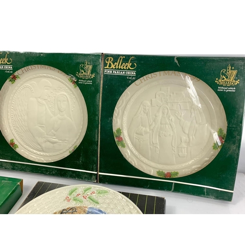 503 - 7 Belleek pottery Christmas plates in boxes. 23cm