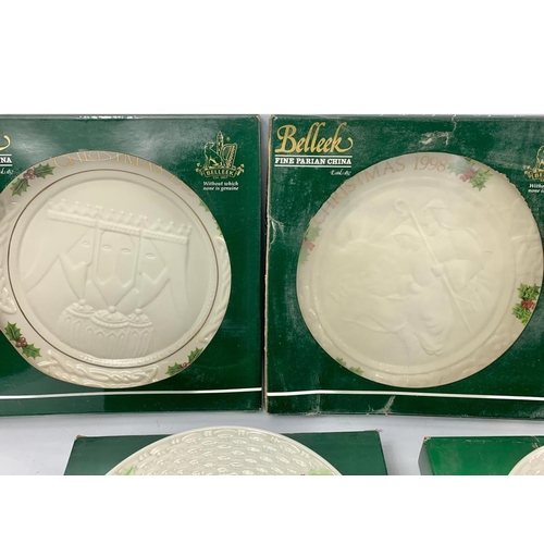 503 - 7 Belleek pottery Christmas plates in boxes. 23cm