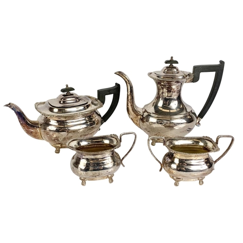 504 - A vintage 4 piece silver plated tea service with a silver plated tray and serving dish