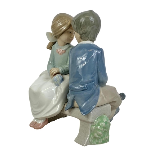 510 - Nao Spanish pottery figurine. “First Love” “Bridal Boy And Girl On Bench” 13 x 16cm