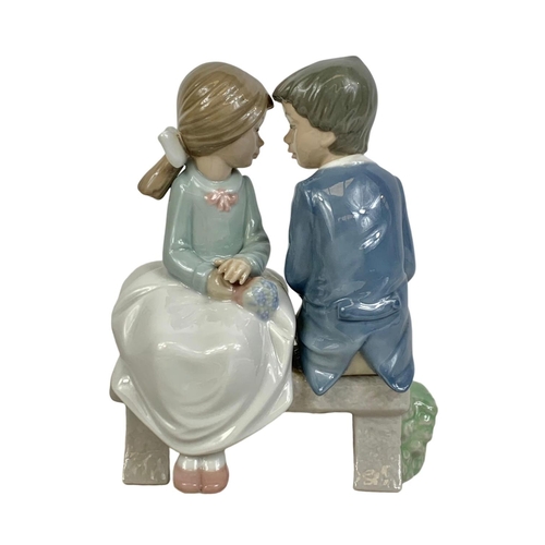 510 - Nao Spanish pottery figurine. “First Love” “Bridal Boy And Girl On Bench” 13 x 16cm