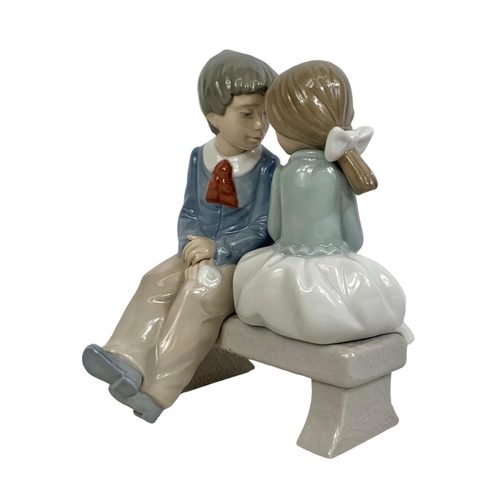 510 - Nao Spanish pottery figurine. “First Love” “Bridal Boy And Girl On Bench” 13 x 16cm