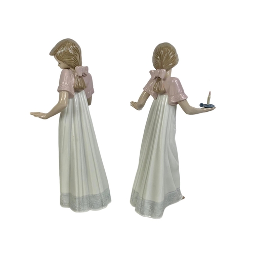 511 - A pair of tall Nao Spanish pottery figurines “To Light The Way” 26cm