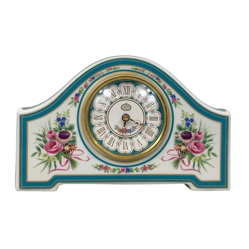 523 - A limited edition Minton Rose china clock. 19 x 12cm