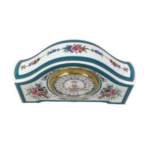 523 - A limited edition Minton Rose china clock. 19 x 12cm