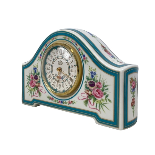 523 - A limited edition Minton Rose china clock. 19 x 12cm