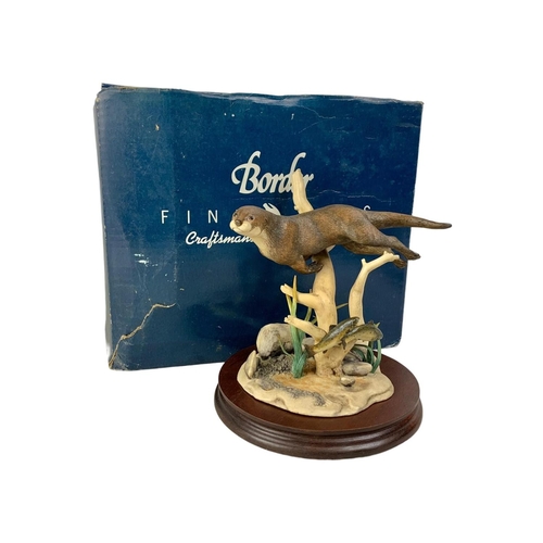 533 - A large Border Fine Arts “Otter and Trout” figure on base in box. Figure measures 17.5 x 19.5cm. Box... 