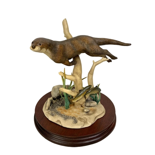 533 - A large Border Fine Arts “Otter and Trout” figure on base in box. Figure measures 17.5 x 19.5cm. Box... 