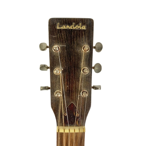 54 - A 1970’s Landola acoustic guitar in case. 101cm