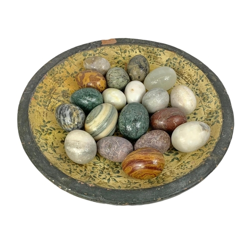 564 - Marble stones on a large decorative terracotta bowl. Bowl measures 41cm