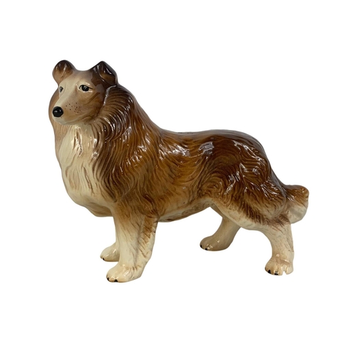 571 - A Melba Ware porcelain dog. 21 x 17.5cm.