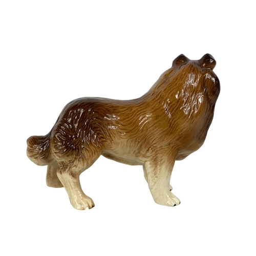 571 - A Melba Ware porcelain dog. 21 x 17.5cm.