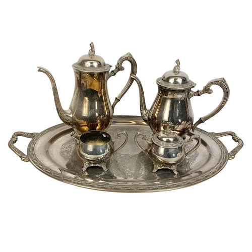 586 - 5 piece silver plated tea service by Oneida. Tray measures 60 x 37cm. Largest pot measures 27 x 27cm... 