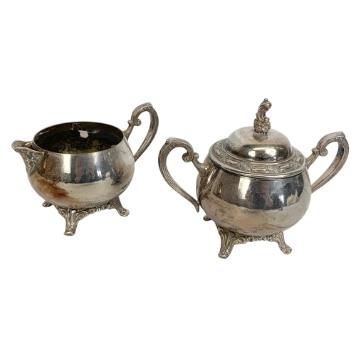 586 - 5 piece silver plated tea service by Oneida. Tray measures 60 x 37cm. Largest pot measures 27 x 27cm... 