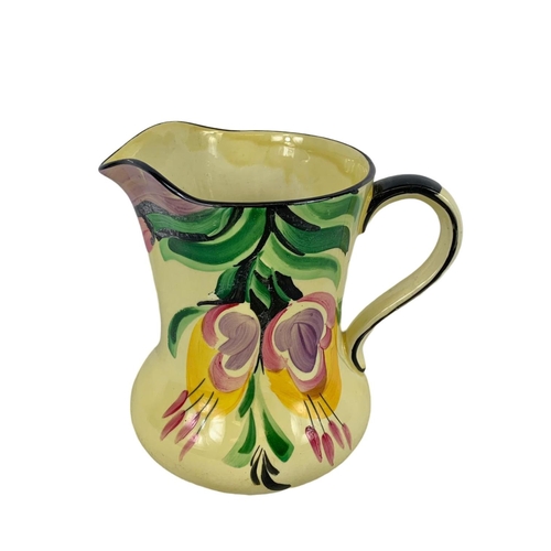 592 - A Wolstan Beswick Art Deco hand painted pottery jug. Number 3/7195. 16cm