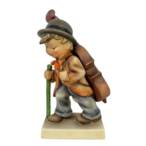 593 - A large M. J. Hummel Goebel pottery figure “Little Cellist” number 89/II 34. 18.5cm.