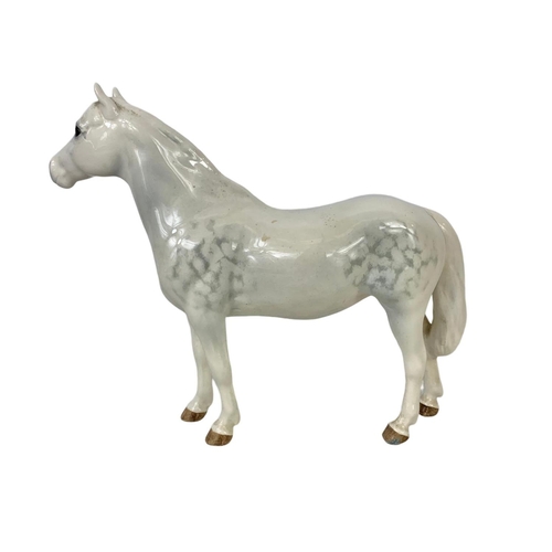 607 - A Beswick Connemara porcelain pony. 22 x 17cm