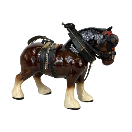 609 - A large porcelain shire horse and wooden cart. Total length 60cm. Horse measures 25 x 19cm. Cart mea... 