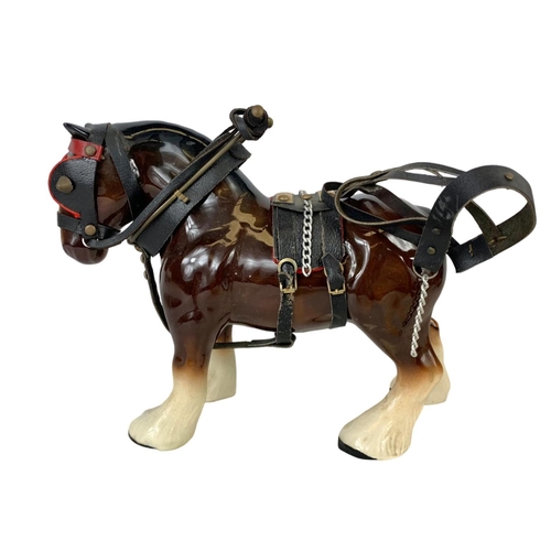 609 - A large porcelain shire horse and wooden cart. Total length 60cm. Horse measures 25 x 19cm. Cart mea... 