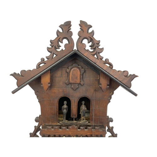 61 - Large late 19th century Black Forest cuckoo clock. With weights and pendulum. Circa 1890. 34 x 55cm