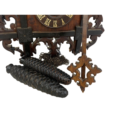 61 - Large late 19th century Black Forest cuckoo clock. With weights and pendulum. Circa 1890. 34 x 55cm