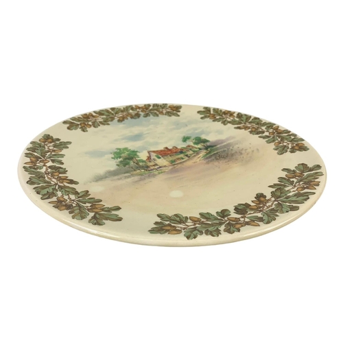 610 - A large Royal Doulton Old English Inns D6072 charger plate 34cm.