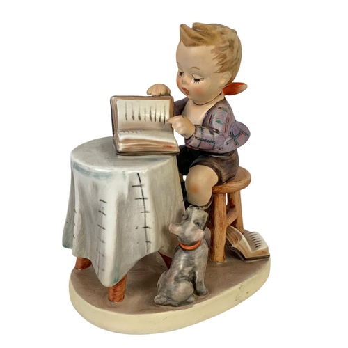 618 - M. J. Hummel Goebel pottery figure “Little Bookkeeper” number 303. 10 x 12.5cm.