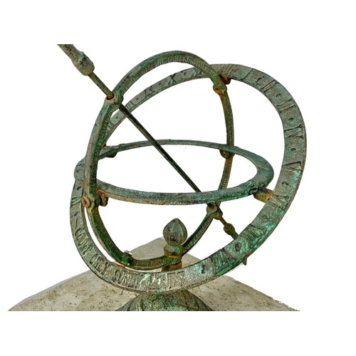 63 - A brass faux bronze sundial sphere on concrete plinth. 29 x 29 x 58cm.