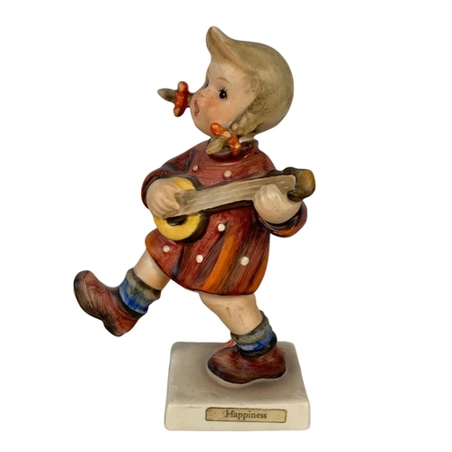 635 - M. J. Hummel Goebel pottery figure “Happiness” number 86. 12cm.