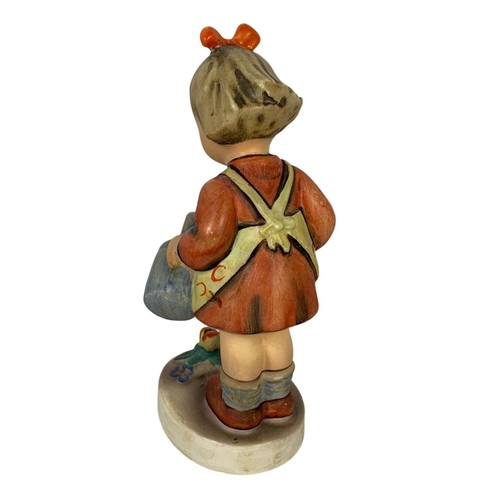 637 - M. J. Hummel Goebel pottery figure “Little Gardener” number 76. 11cm.