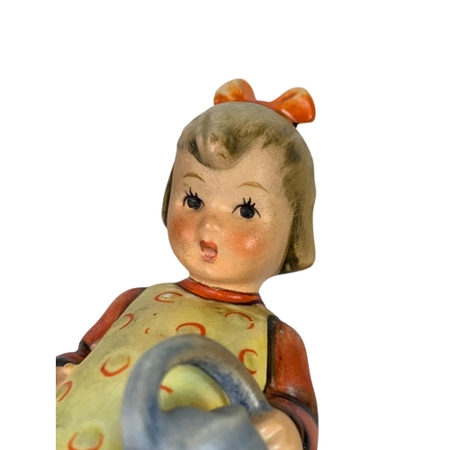 637 - M. J. Hummel Goebel pottery figure “Little Gardener” number 76. 11cm.