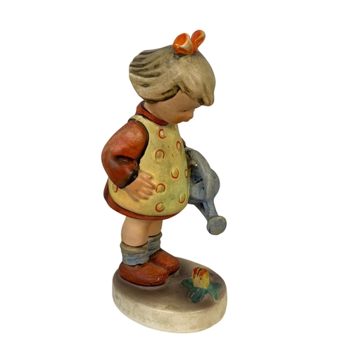 637 - M. J. Hummel Goebel pottery figure “Little Gardener” number 76. 11cm.