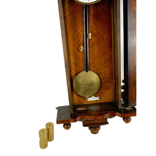 64 - A large Victorian Vienna wall clock. With weights and pendulum. 127cm