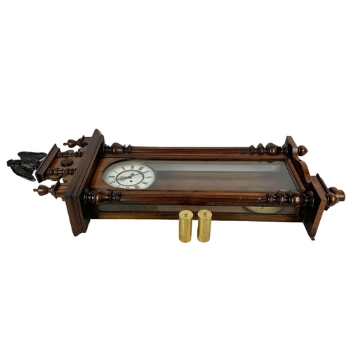 64 - A large Victorian Vienna wall clock. With weights and pendulum. 127cm