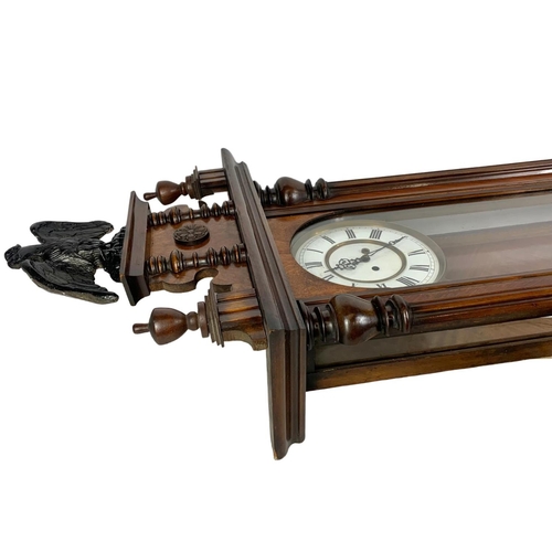 64 - A large Victorian Vienna wall clock. With weights and pendulum. 127cm