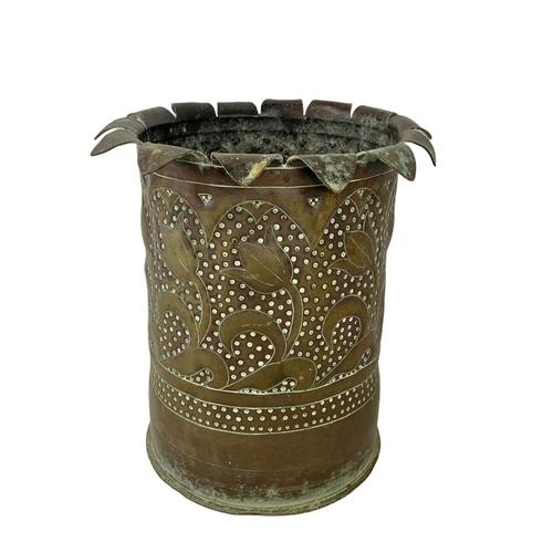 65 - An Arts & Crafts Trench Art pot. 21 x 22cm.