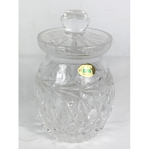 650 - A Thomas Webb crystal vase,  a pair of Tyrone crystal candlesticks and a Tyrone crystal jar. Vase me... 