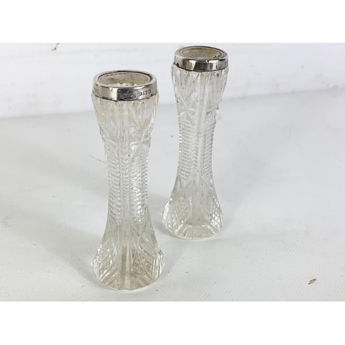 660 - Pair of sterling silver and cut glass vases. Birmingham. 10cm