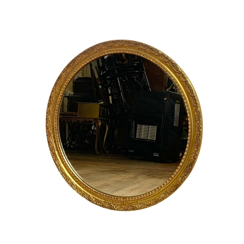 7 - Ornate gilt framed mirror. 52cm