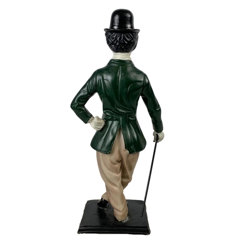 720 - A large Charlie Chaplin figure. 43cm.