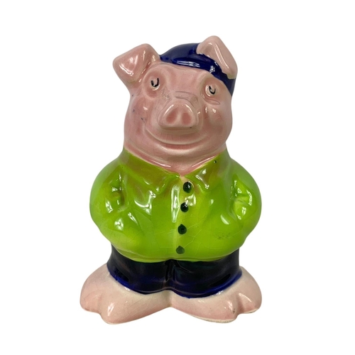 723 - A Wade Nat West pottery piggy bank. 14cm.