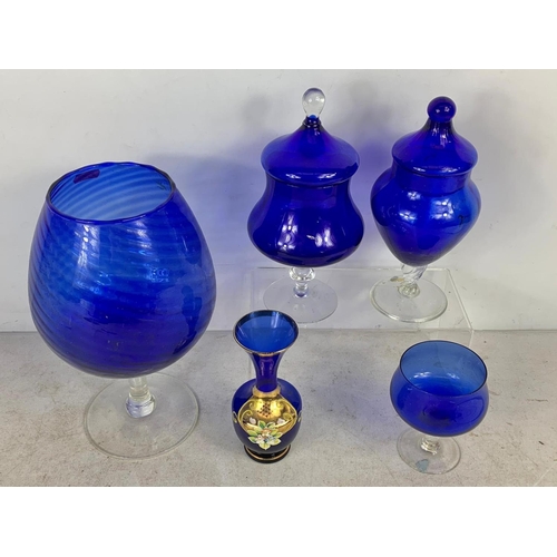 733 - 5 pieces of vintage blue glassware. Large vase measures 27cm