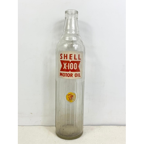 77 - Vintage Shell X-100 Motor Oil glass bottle. 35cm