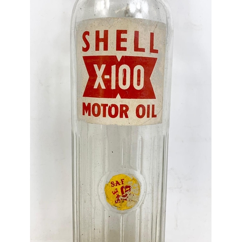 77 - Vintage Shell X-100 Motor Oil glass bottle. 35cm