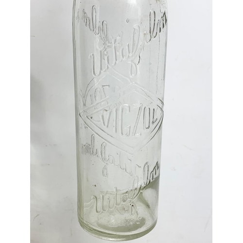 78 - 2 vintage Vigzol glass oil bottles. 33cm