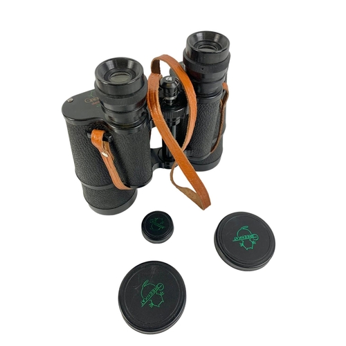 88 - Pair of Greencat binoculars in leather case. Case measures 21 x 19.5cm