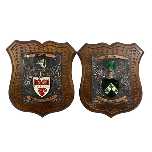 94 - 7 wall mounted family crests. Largest 30 x 37cm