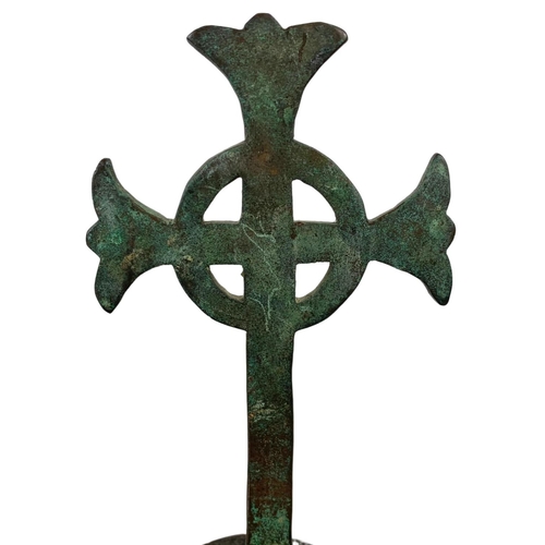 20b - A 19th century bronze Celtic cross on wooden base. 21.5cm.