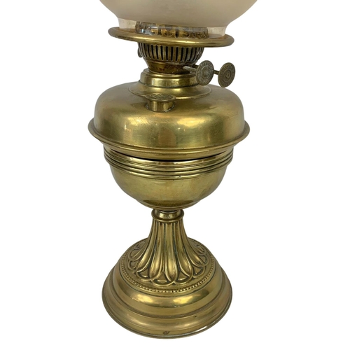 323 - An Edwardian brass oil lamp. 57cm.